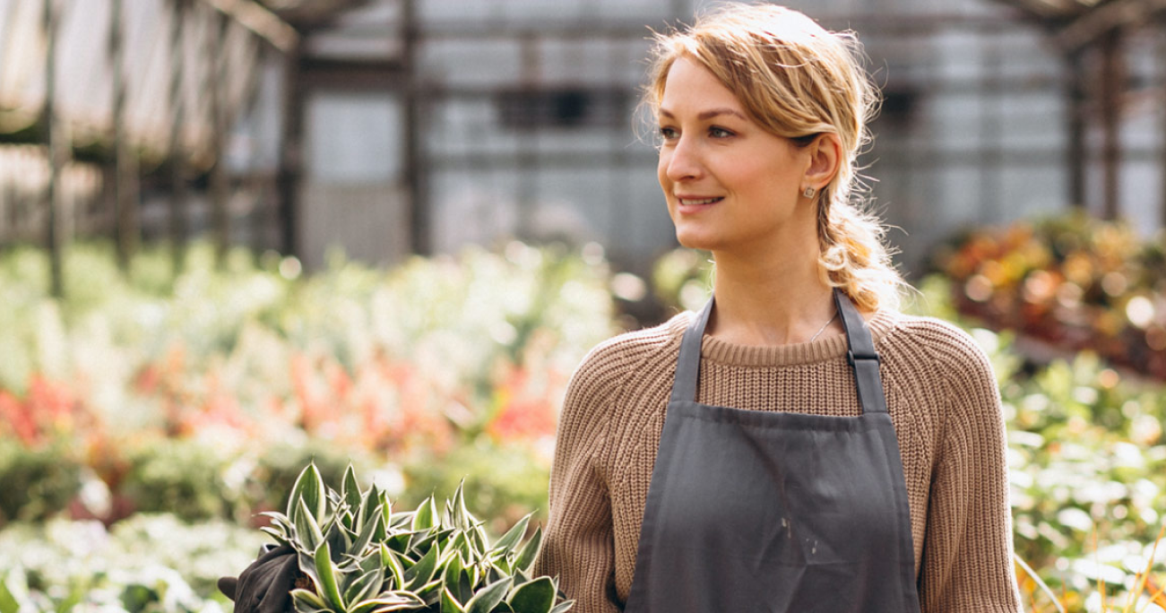 A woman in an apron at the garden | Careers Collectiv